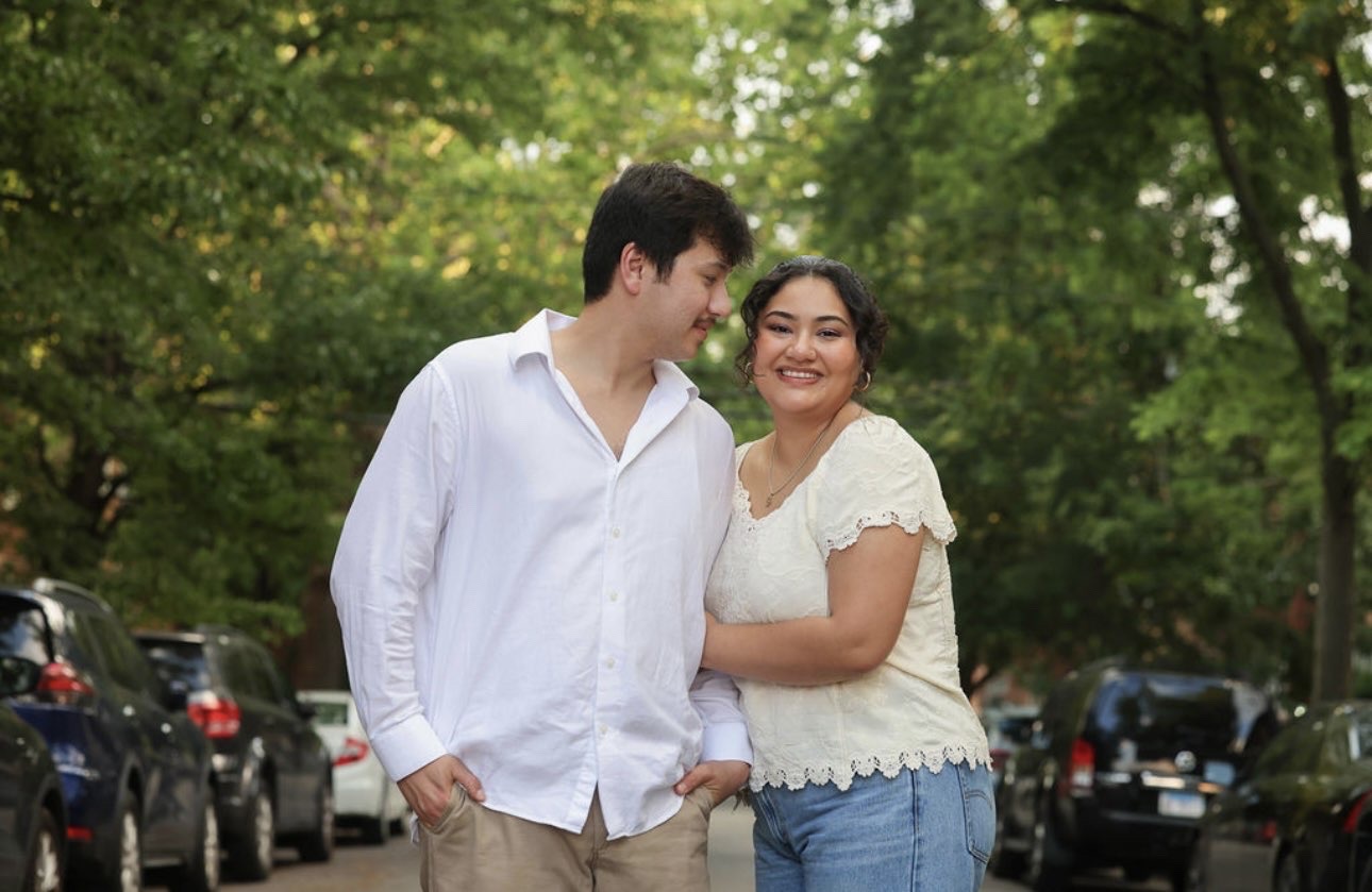 Ethan and Elli laughing on a tree-lined Chicago street